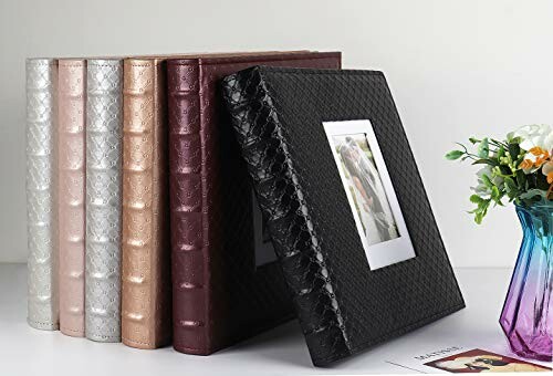 Black photo album with dimensions displayed and a cover photo insert.