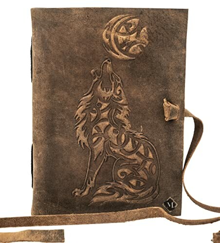 Leather journal with embossed wolf design.